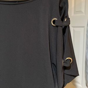 Black blouse. Formal or dressy casual.